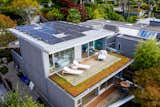 The solar photovoltaic rooftop panels draw 12 kilowatts of electricity. The prefabricated cross-laminated timber structure is insulated by 17-inch walls, and the deck outside the master bedroom is bordered with sedum.