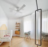 The nursery is situated in the chamfered corner of the 1950s apartment.