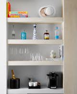 The same wood shelving was used for the minibar in the living area.