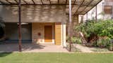 The bamboo pergola provides essential shading to the southwest facing elevations.  Photo 6 of 18 in This Leafy Green Garden Dwelling in India Has an Endless Pool