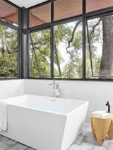 Master bath tub, bright and airy, custom floor tile