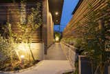 Outdoor, Wood Fences, Wall, and Garden Alley space to the entrance  Photo 1 of 7 in House with alley by Takahiro  Isseki