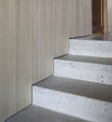 Material detail: concrete floor and stairs, aspen walls.
