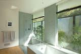 The master bathroom opens up to a private garden and ample light. A ‘wet-zone’ is denoted by mosaic marble.