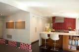 View towards the new kitchen, with counter seating at the peninsula.