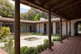 Through new additions, Dutton Architects created a  courtyard, with a central fountain, a decomposed granite (d.g.) surface, and corner and edge plantings of native plants that might have been used in the original 1920’s house.