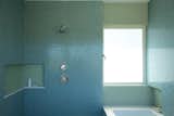 The shower is not an enclosed space, but part of a larger ‘wet area’ within the bathroom.