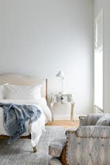 Airy white master bedroom.