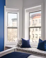 Custom window seat in teens bedroom.