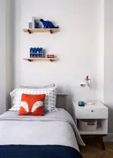 Floating display shelves in fun teen room.