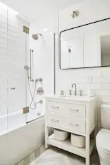 Full bath with chevron flooring.