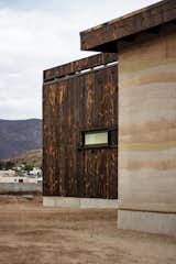 Burned wood and rammed earth