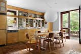The kitchen’s shelving and cabinetry was a product of an early 1990s renovation, still featuring ceramic masks the Merzes purchased in Mexico. 