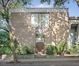 The corner house’s most prominent feature is a keyhole window that resembles Louis Kahn’s Esherick House. 