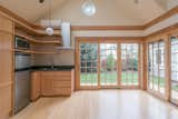 Kitchen and living area with sliding glass panels