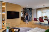Due to large windows, the living room openly extends onto the terrace where the cascade on the ceiling ends in a semi-circular contour - rich curtains being placed in its form to soften the views to the outside. ​​​​​​​​