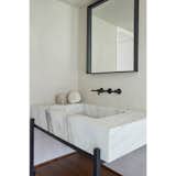 Custom marble sink and mirror in steel frame