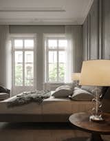 Bedroom, Chair, Bed, Light Hardwood Floor, and Table Lighting  Photo 5 of 8 in Copenhagen Apartment 001 by Marcin