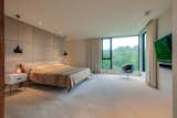 Bedroom, Carpet Floor, Recessed Lighting, Night Stands, Pendant Lighting, Bed, Table Lighting, and Accent Lighting The Master  Photo 5 of 11 in Hillside Contemporary on East Valley by Jackson Zeitlin