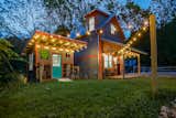 Exterior, Shed RoofLine, Tiny Home Building Type, Metal Siding Material, Concrete Siding Material, Metal Roof Material, Wood Siding Material, Gable RoofLine, and Stucco Siding Material Front of house and shed/bike shop  Photo 1 of 36 in Mountain Bikers Tiny House Getaway by Ryan Jacques