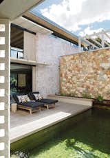 Outdoor, Decking Patio, Porch, Deck, Side Yard, Swimming Pools, Tubs, Shower, Small Patio, Porch, Deck, Shrubs, Wood Patio, Porch, Deck, Stone Fences, Wall, and Small Pools, Tubs, Shower The inner courtyard with deck and eco-pool  Photo 20 of 34 in 68 Jonkershoek - nature , water, and material textures feature in this South African home by Mieke Vermaak