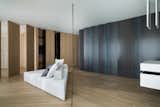 The line climbs onto the ceiling where it becomes a lighting feature for the living area.