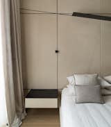 Bedside lamp and oblique shelves inspired by Malevich paintings.