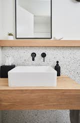 Bath Room, Vessel Sink, Wood Counter, and Terrazzo Floor 1/2 bath  Photo 1 of 22 in EGR Mid-Century Modern by Hygge Design+Build