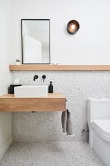 Bath Room, Terrazzo Floor, Wood Counter, Wall Lighting, and Vessel Sink 1/2 Bath  Photo 19 of 22 in EGR Mid-Century Modern by Hygge Design+Build