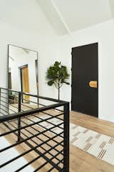 Hallway and Light Hardwood Floor Foyer  Photo 4 of 36 in The Slate House by Hygge Design+Build