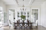 Old Grove estate formal dining room with coffered ceilings, custom build in display cases. Right hallway leads to formal den, built in cabinetry, guest bathroom, and over sized laundry room. Left hallway leads to ktichen, mudroom, screened in porch, and pantry with painted floors. 