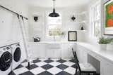 Old Grove estate featuring painted wood floors, built-in custom cabinetry, sliding ladder, and Dutch door leading into the mud room.