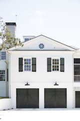 Old Grove side of the house with double carriage garage doors. Old world vibe, with a new crisp feel.  Photo 17 of 24 in Old Grove by Nautilus Homes