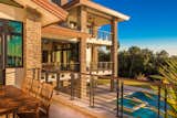 Outdoor dining area viewing the 3 level porch areas all overlooking the pool