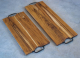 Plantation Teak Serving/Charcuterie Boards.
Sleek and sophisticated, the colors and wood grain of these gorgeous Plantation Teak Serving or Charcuterie boards are a great contrast to the creamy colors of your favorite artisan cheeses and textures of meats and pastries. 

To purchase:
https://toddalanwoodcraft.com/collections/charcuterie-boards/products/plantation-teak-serving-charcuterie-boards

These Plantation Teak boards make an excellent gift for the foodie friends in your life!  Also, they are great serving boards for restaurants, caters and chefs.

The curved hand cutaway in the board, along with the stylish wrought iron handles, make for easy grip, lift and carrying of the board.  The board also rests above your table surface by non-skid feet with stainless steel hardware. 

