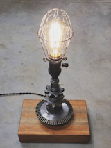 Gear Lamp with Cage

Repurposed gears with 1910 porcelain switched socket, all set in a reclaimed Jatoba wood base.

For more information or to purchase, contact us at orders@toddalanwoodcraft.com
