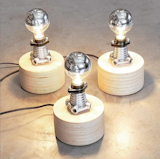 Our  Baltic Birch light pods utilizing reclaimed cast aluminum risers with black ceramic sockets. The bulb is a LED down light style which illuminates the details below.