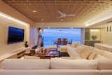 Living Room, Sofa, Coffee Tables, Ceiling Lighting, Pendant Lighting, Ottomans, and Wall Lighting Living, terrace and the sea  Photo 10 of 15 in ACAPULCO GP APARTMENT by PAIR