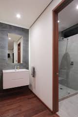 Bath Room, Medium Hardwood Floor, Ceramic Tile Wall, and Ceiling Lighting  Photo 14 of 17 in BR House by PAIR