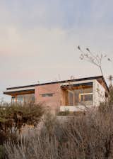Lateral Facade, concrete core and elongated rooflines