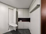 In fact, the laundry room would make William Lawrence Murphy proud. One door reveals a dropdown ironing board.