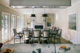 Dining Room, Table, Medium Hardwood Floor, Standard Layout Fireplace, Chair, Ceiling Lighting, and Wood Burning Fireplace  Photo 3 of 7 in East Goes West by Fergus Garber Architects