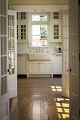 Kitchen, White Cabinet, Marble Counter, Medium Hardwood Floor, Ceiling Lighting, Subway Tile Backsplashe, Dishwasher, and Drop In Sink  Photo 4 of 11 in Timeless Traditional by Fergus Garber Architects