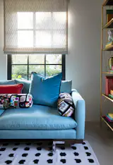 Family room with 6 over 6 double hung window.