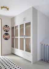 Mudroom lockers adjacent to the staircase down to the basement.