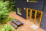 Large folding doors open the home to the private yard, raised bed gardens and picnic area.