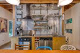 Kitchen with open low maintenance metal shelving.
