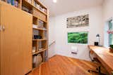 Office space with built-in wood desk for two.