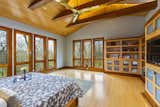 ● Custom built maple and cherry trimmed cabinets, TV cabinet and bookshelves by BC Woodworking
● Custom made platform bed with built in side tables and underneath storage drawers by BC Woodworking - can convey
● 84” gold Haiku fan does not convey
● 4 operable clerestory windows
● Haiku light in entry - NEW
● 2 gold Carpyen Yoko LED wall sconces - NEW
● Windows on 2 exposures