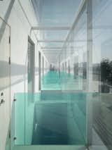 The top floor removed part of the original solid wall and replaced it with a glass curtain wall to provide sufficient light for the interior space